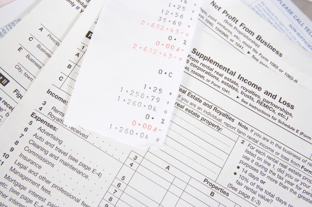 10046722_closeup-of-tax-forms-with-receipt